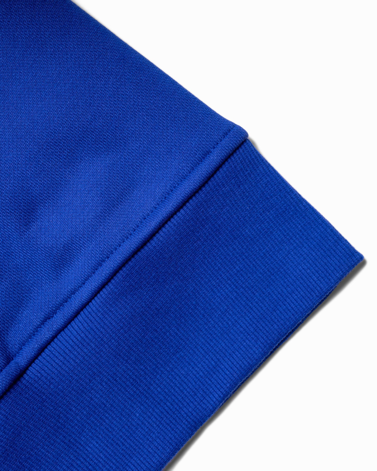 Close-up of the high-quality waistband on the Flossy blue hoodie, showcasing durable stitching.