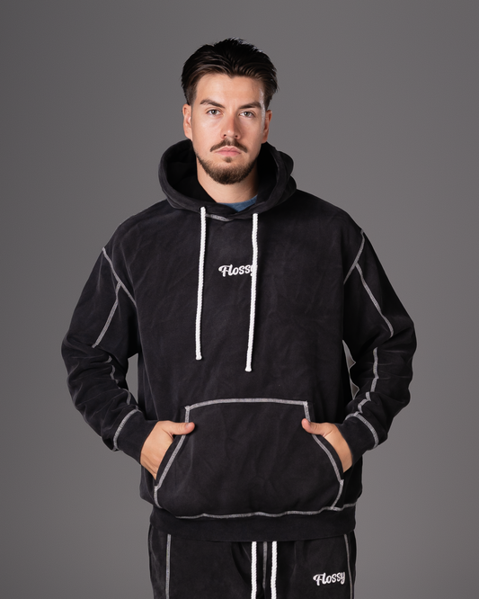 Flossy acid wash black hoodie with embroidered logo at chest, front view