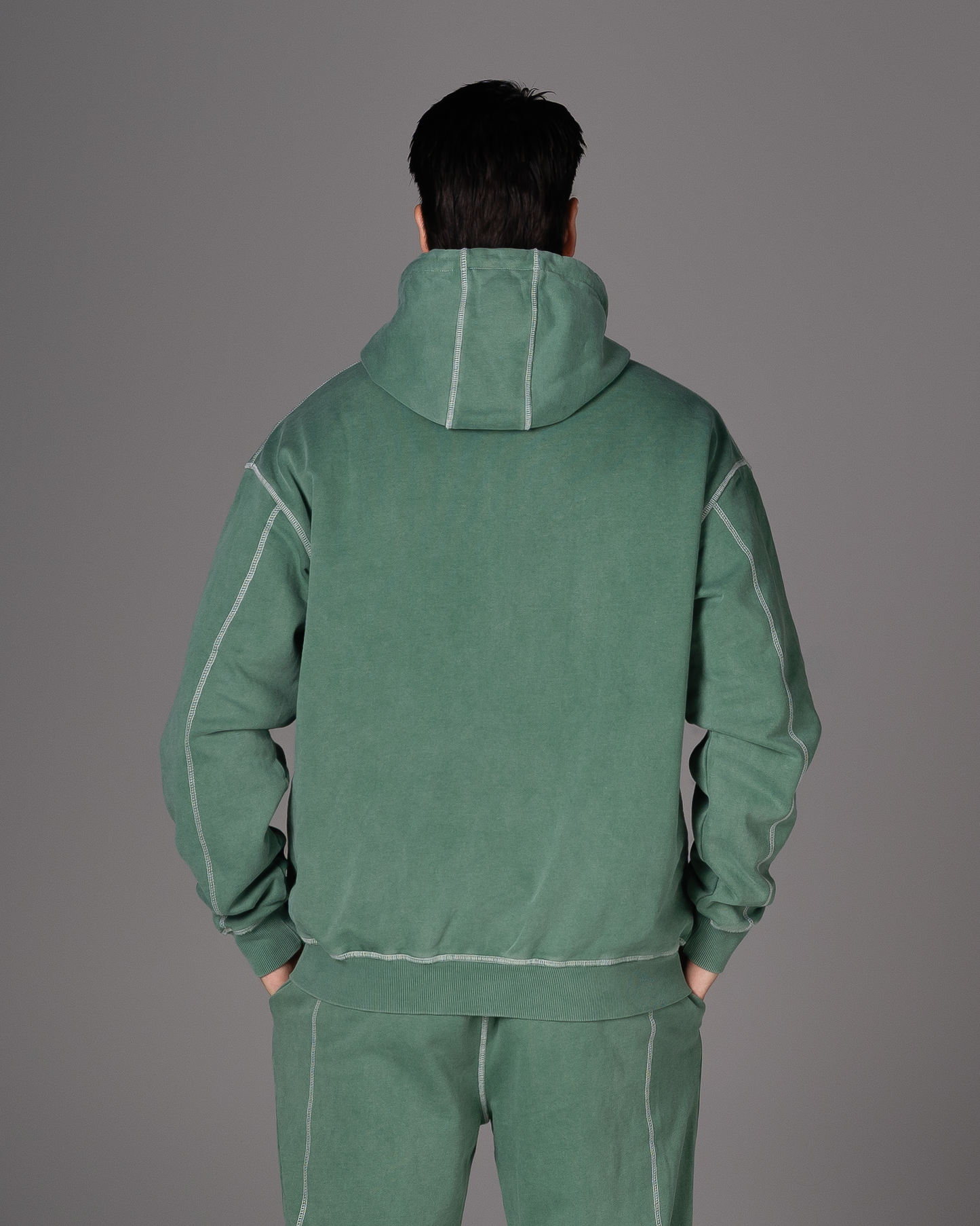 Flossy acid wash green hoodie, back view showing relaxed fit