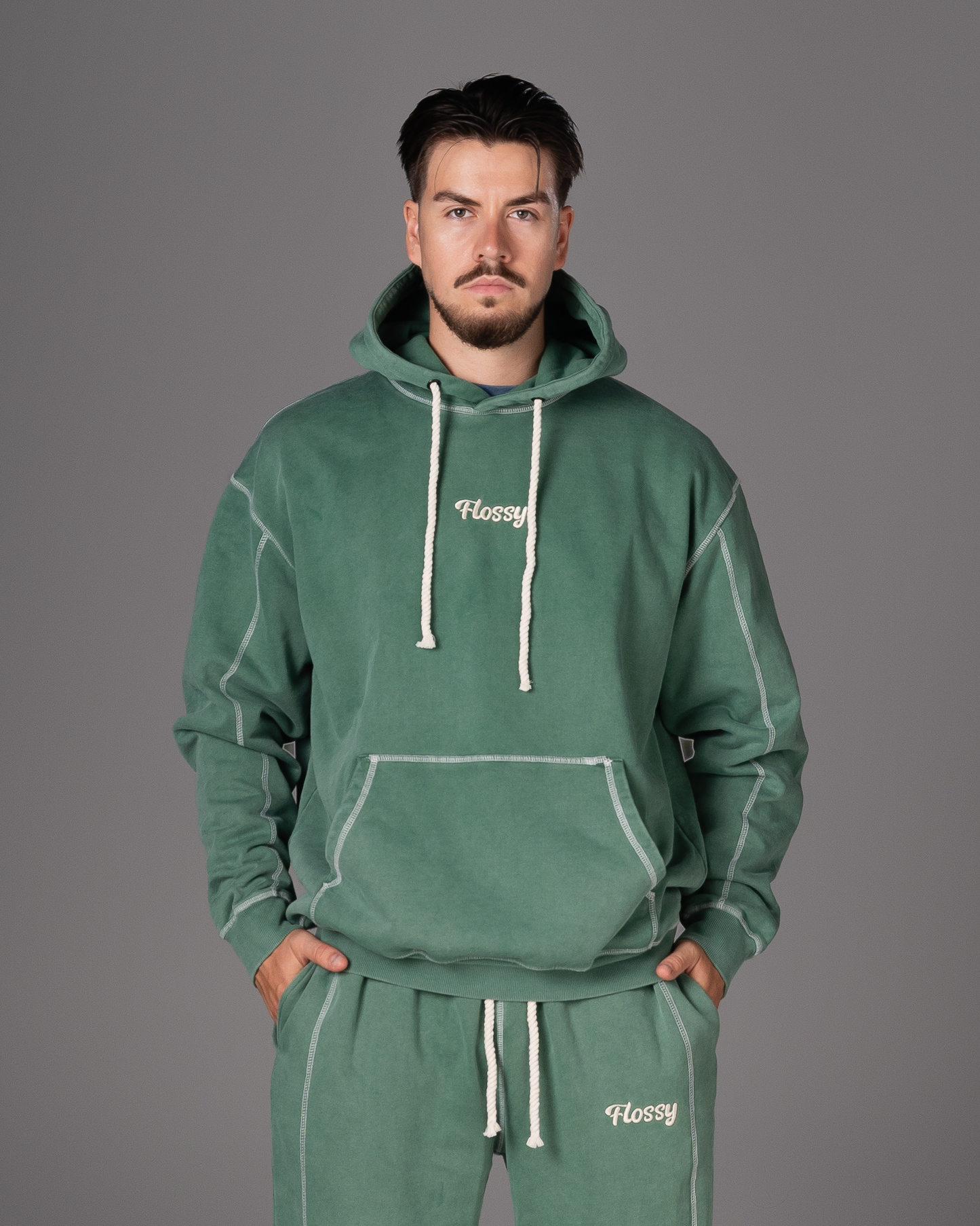 Flossy acid wash green hoodie with embroidered logo at chest, front view