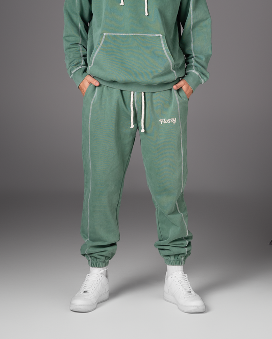 Flossy acid wash green joggers with rope drawstring and embroidered logo, front view
