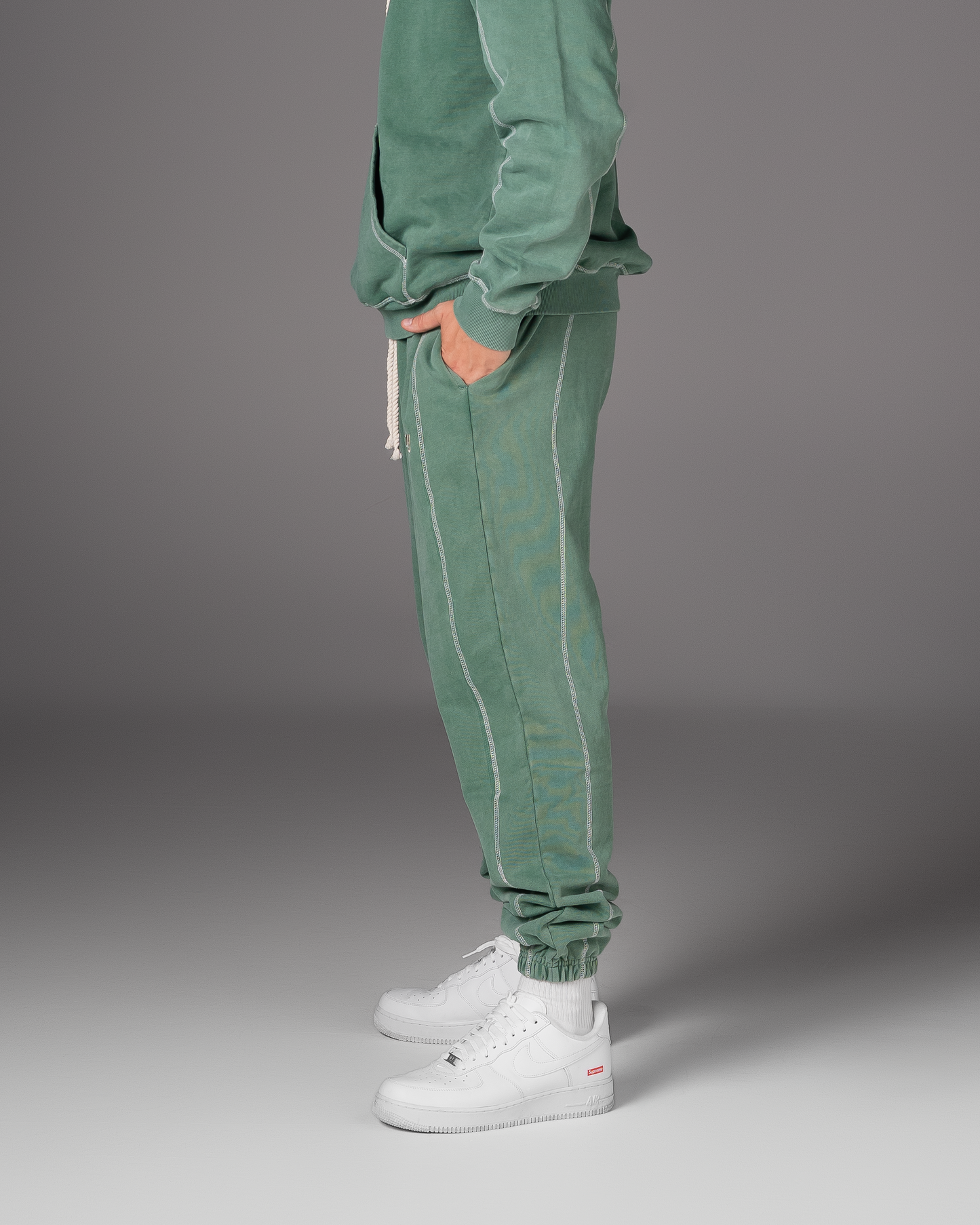 Flossy acid wash green joggers, side profile showing relaxed leg fit