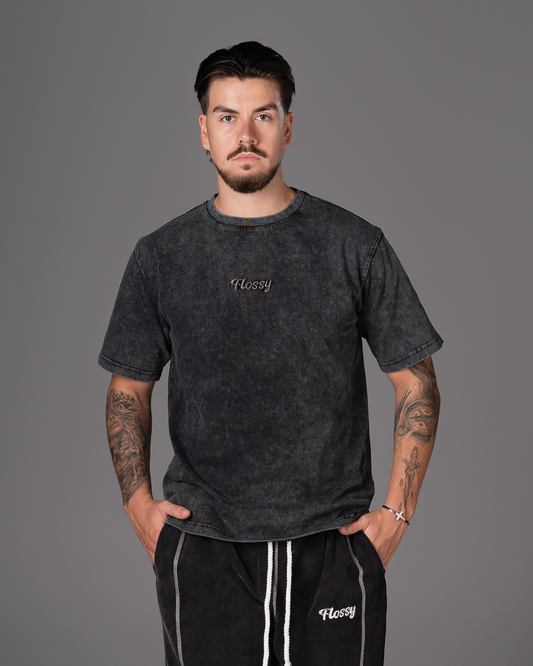 Flossy acid wash black tee with tonal embroidered logo at chest, front view