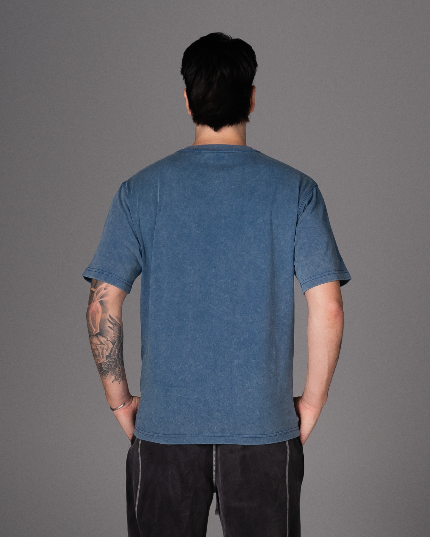 Flossy acid wash blue tee, back view showcasing relaxed fit