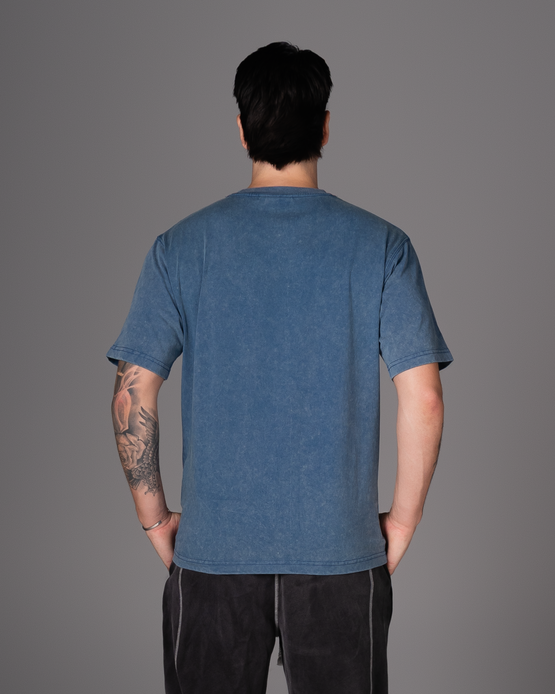 Flossy acid wash blue tee, back view showcasing relaxed fit