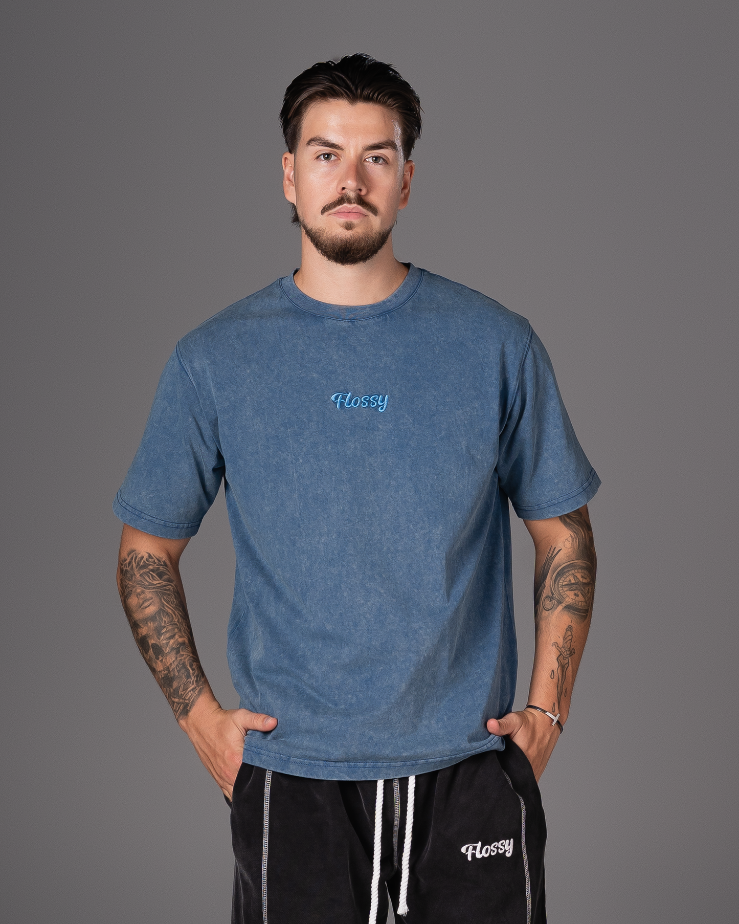 Flossy acid wash blue tee with tonal embroidered logo at chest, front view