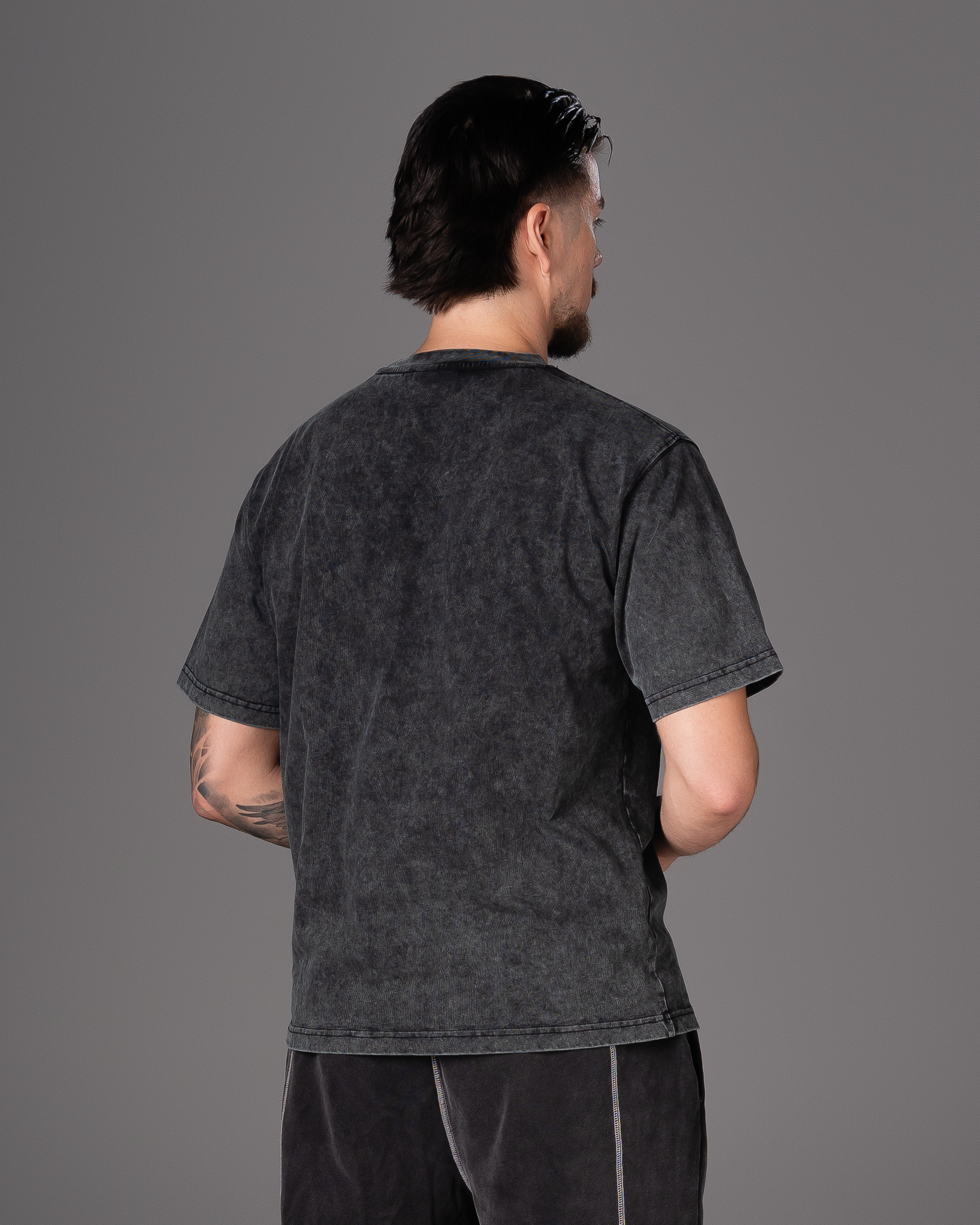 Flossy acid wash black tee, back view showcasing relaxed fit